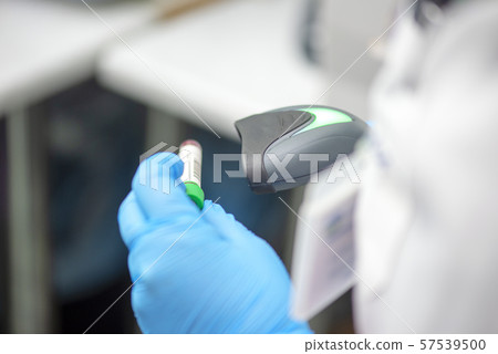 Bar code scanner and test tube over monitor Bar code scanner and test tube over monitor 57539500