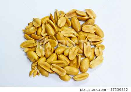 Dry roasted peanuts on a white background. 57539832