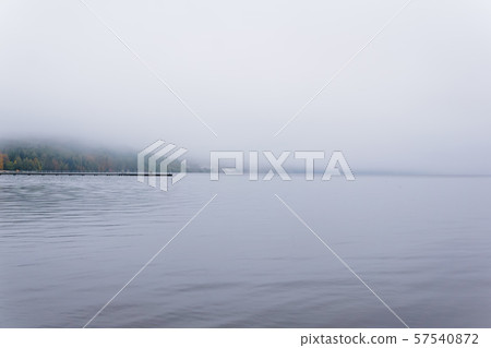 mountain lake hidden by fog 57540872