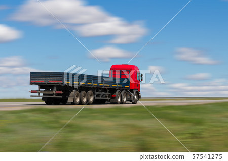 the truck goes on the highway in summer day the truck goes on the highway in summer day 57541275