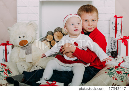 Portrait of happy children with Christmas gift 57542447