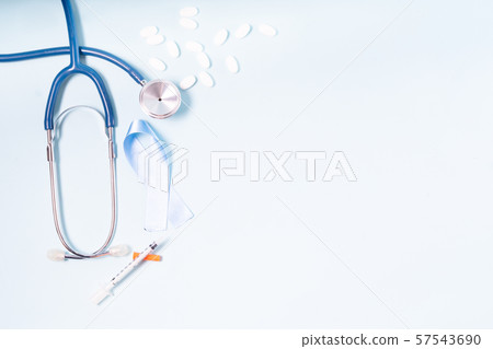 White pills on blue background White pills on blue background 57543690