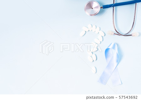 White pills on blue background White pills on blue background 57543692