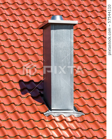 Chimney on clean roof of house Chimney on clean roof of house 57544110