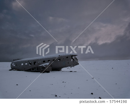 Crashed plane on a snowy field in iceland 57544198