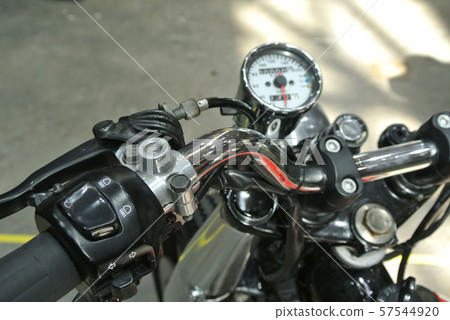 Selective focused on the high performance motorcycle handle bar and all the equipment attached to it.   57544920