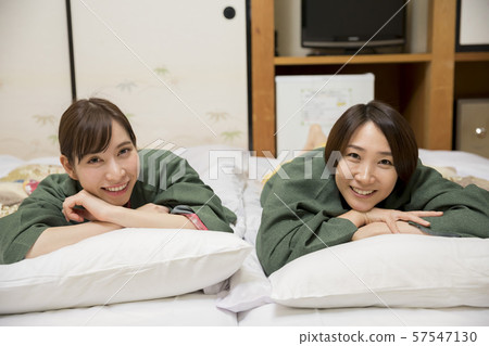 Women lying on the futon in the inn room Women's travel image GoTo Travel Campaign Women lying on the futon in the inn room Women's travel image GoTo Travel Campaign 57547130