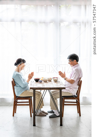 Senior couple's meal (vertical position) Senior couple's meal (vertical position) 57547347