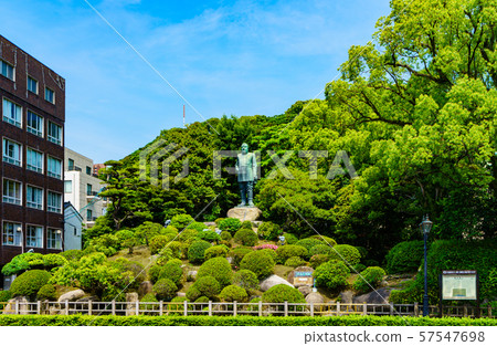 Sightseeing spots in Kagoshima: A statue of Takamori Saigo, a hero of the region and a representative of the Meiji Restoration (backed by Shiroyama and the blue sky) Sightseeing spots in Kagoshima: A statue of Takamori Saigo, a hero of the region and a representative of the Meiji Restoration (backed by Shiroyama and the blue sky) 57547698