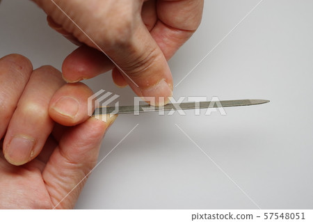 Taking care of nails with a nail file 57548051