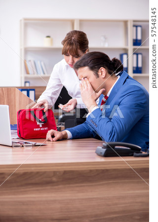Young employee suffering in the office Young employee suffering in the office 57548145