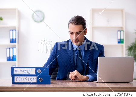 Young male accountant working in the office Young male accountant working in the office 57548372