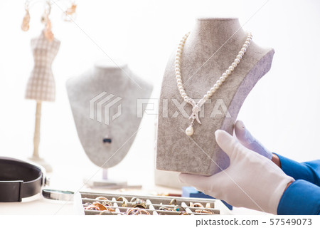 Young jeweler working in his workshop 57549073