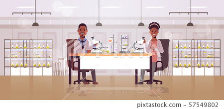 scientists couple using microscope african american man woman making experiments in chemistry scientists couple using microscope african american man woman making experiments in chemistry 57549802