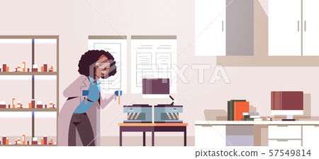 scientist holding test tubes with blood samples african american woman in uniform using analyzer scientist holding test tubes with blood samples african american woman in uniform using analyzer 57549814