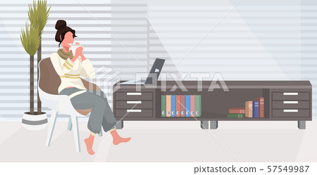 girl sitting on armchair using laptop happy woman freelancer working at home drinking coffee modern 57549987