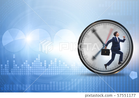 Businessman employee in time management concept Businessman employee in time management concept 57551177