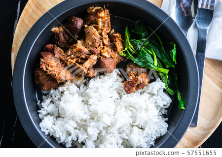 The streamed pork and rice on the table of restaurant The streamed pork and rice on the table of restaurant 57551655
