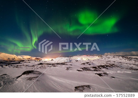 Northern Lights on the shore of the Arctic Ocean. Northern Lights on the shore of the Arctic Ocean. 57552889