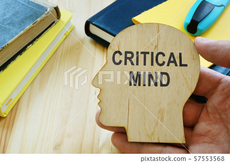 Critical mind sign on the wooden haed shape. 57553568