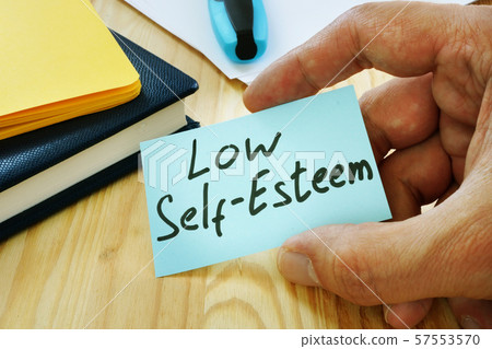 Low Self esteem sign in the hand. 57553570