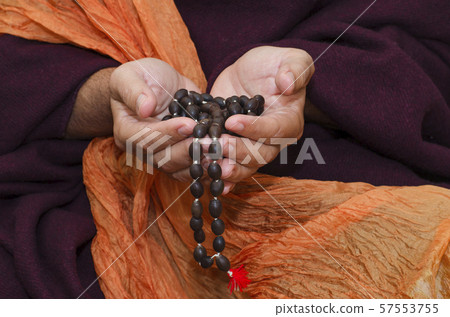 Buddhist Monk with mala beads Buddhist Monk with mala beads 57553755