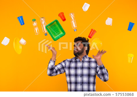 World Environment Day, plastic recycling problem and environmental disaster concept - annoyed Indian 57553868