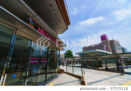 Center of Kagoshima City: Kagoshima Chuo Station, the center of Kagoshima's downtown area, and commercial facilities in front of the station, against the blue sky 57555318