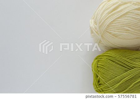 Skeins of white and green on a background with space for text 57556781