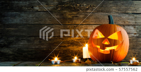 Halloween pumpkin and candles 57557562