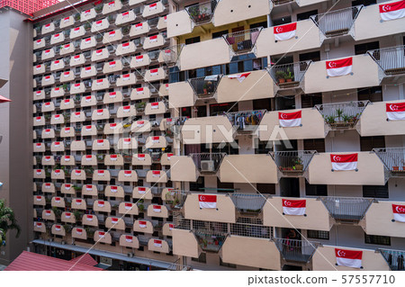 A Singaporean flag on a public housing in Singapore, HDB A Singaporean flag on a public housing in Singapore, HDB 57557710
