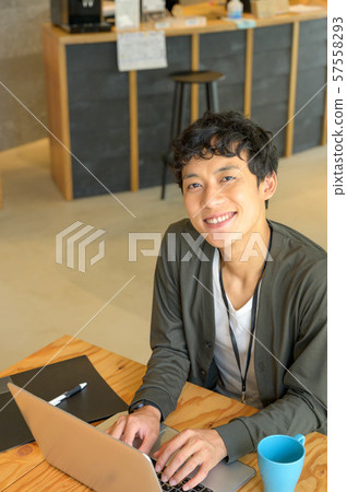 A man working at a cafe 57558293