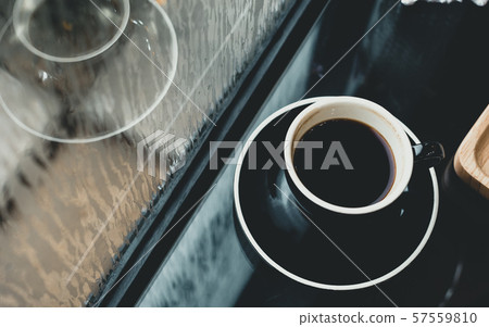 Black coffee cup on table in cafe restaurant near Black coffee cup on table in cafe restaurant near 57559810
