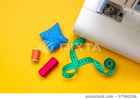 Close up foot of sewing machine and handcraft 57560206