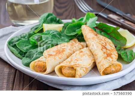 Savory crepe with shrimps and creamy dill sauce Savory crepe with shrimps and creamy dill sauce 57560390