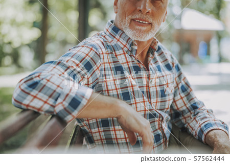 Man on the bench relaxing in park stock photo Man on the bench relaxing in park stock photo 57562444