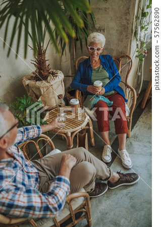 Happy lady with coffee in the cafe stock photo 57562890