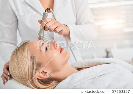 pleasant blonde girl having anti aging rejuvenation procedure pleasant blonde girl having anti aging rejuvenation procedure 57563397