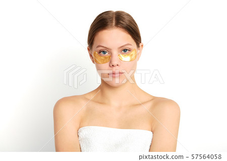 young shirtless model with cosmetic mask posing to the camera 57564058
