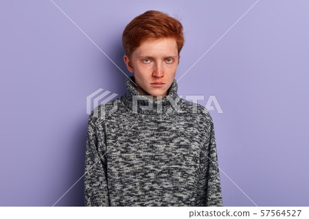 drunk young man with blue eyes looking at the camera drunk young man with blue eyes looking at the camera 57564527