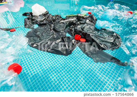 Plastic recycling, pollution and environmental concept - Environmental problem of plastic rubbish 57564866