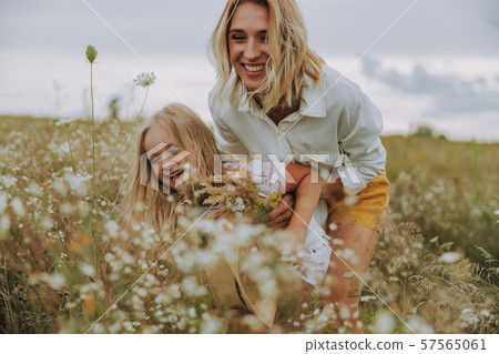 Happy woman having fun with her daughter 57565061