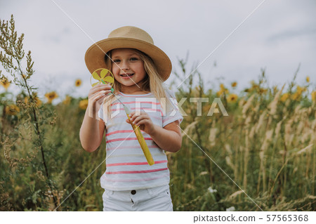 Caucasian smiling kid having rest near the field 57565368