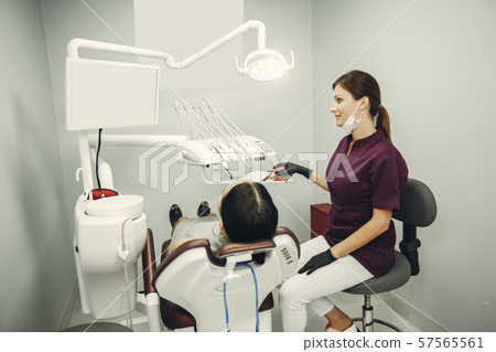 Beautiful girl in a dentist 57565561