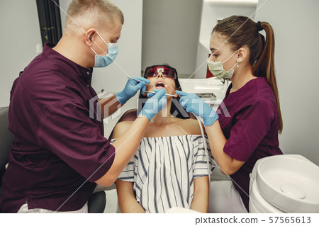 Beautiful girl in a dentist 57565613