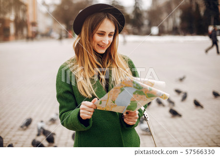 Beautiful woman walking in a spring park 57566330