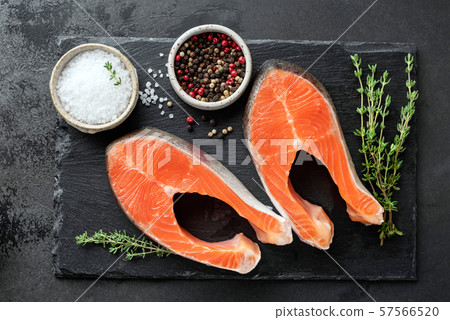 Salmon steaks, spices and herbs for cooking Salmon steaks, spices and herbs for cooking 57566520