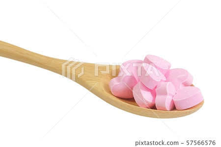 Wooden Spoon Full with Vitamins C on White 57566576
