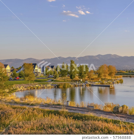 Trail and homes in Oquirrh Lake against mountain 57568888