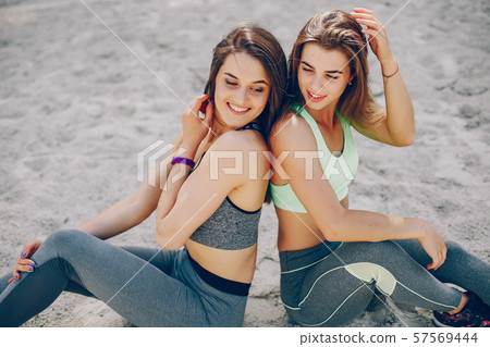 Two girls on a beach 57569444
